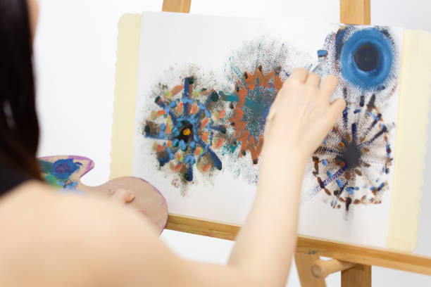 istock Artist painting on an easel 1157586651