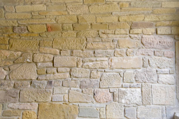 Old wall made of natural stone Old wall made of natural stone sand stone wall stock pictures, royalty-free photos & images