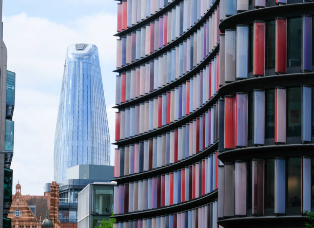 Two New Ludgate & One Blackfriars, the changing skyline of London 30th May 2019: Looking down Old Bailey in the City of London district, the changing face of London's skyline is striking. Opposite the Central Criminal Court, known as the Old Bailey, stands the colourful new building, with glass panels - Two New Ludgate also known as Mizuho House, designed by architects Sauerbruch Hutton and completed in 2015, occupied by Mizuho Bank London branch. Looking further on is One Blackfriars, nicknamed The Vase & The Boomerang, designed by architects SimpsonHaugh and completed in 2018 - It is an exclusive residential tower block, with high-end apartments and a hotel. bankside photos stock pictures, royalty-free photos & images