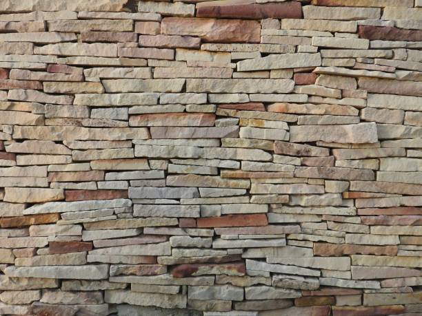 istock Old wall made of natural stone 1157587913