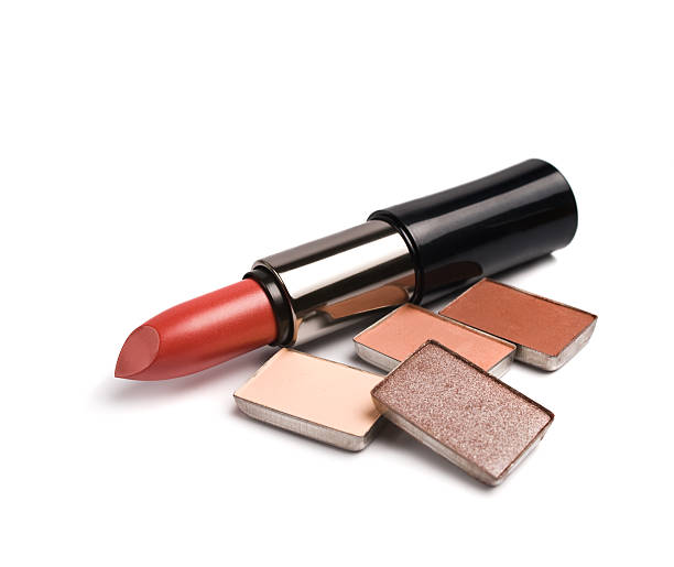 istock Lipsticks and eye-shadows isolated on white background 115758862