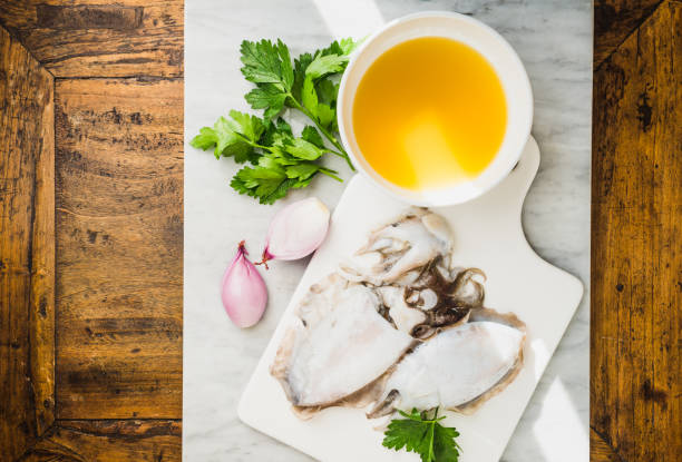 fresh cuttlefish and fish broth ingredients for cooking sauce. - choco imagens e fotografias de stock