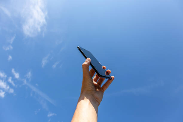 istock cell phone against the sky 1157593518