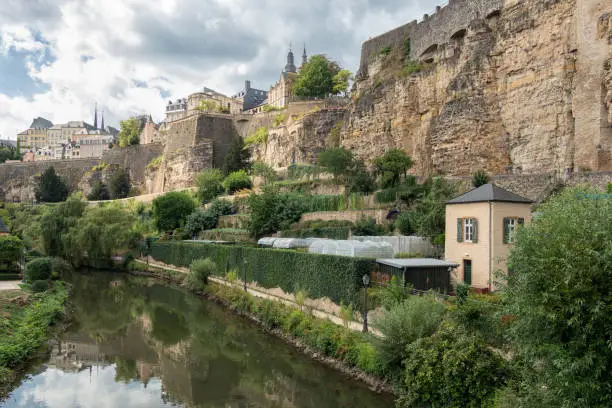 Alzette river Luxembourg city downtown Grund with medieval fortifications and vegetable gardens at riverside