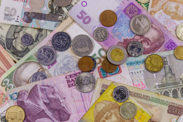 istock Background of banknotes and coins from different countries 1157601110