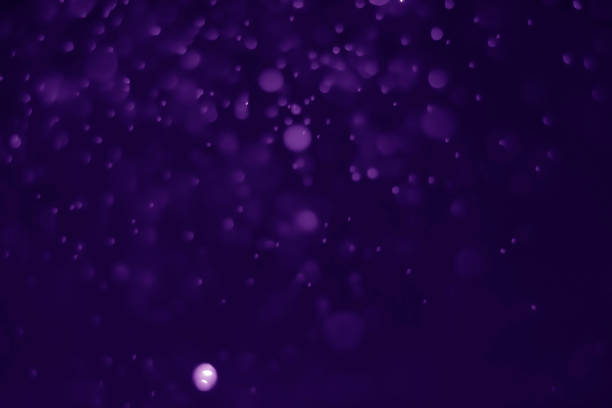 istock Bokeh purple proton background abstract 1157602488