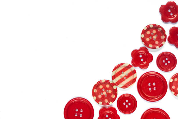 istock Various red sewing buttons isolated on background with place for text 1157602525