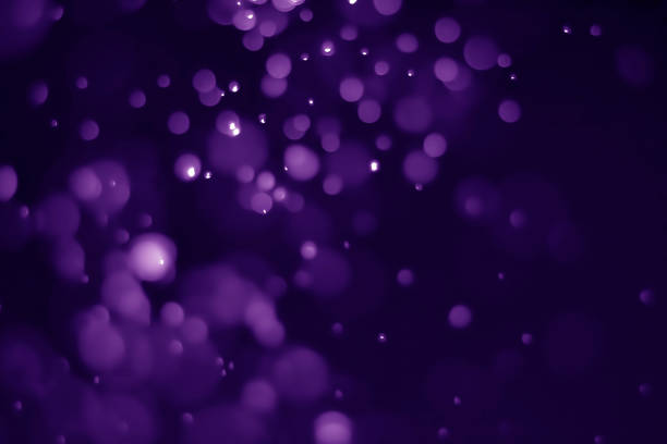 istock Bokeh purple proton background abstract 1157602527