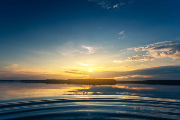 istock Beautiful sunrise over lake 1157608385