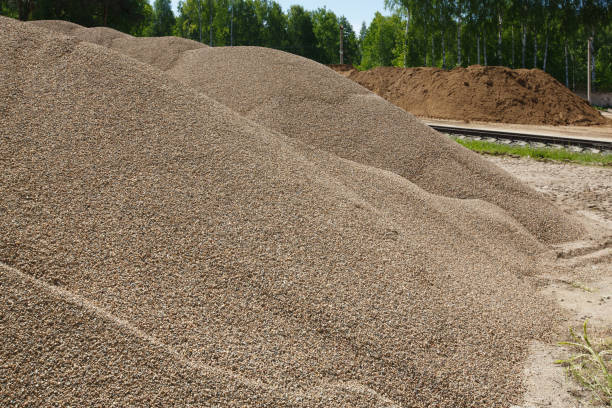 Pile of building material - gravel and sand. Pile of building material - gravel and sand. Pea Gravel supplier stock pictures, royalty-free photos & images