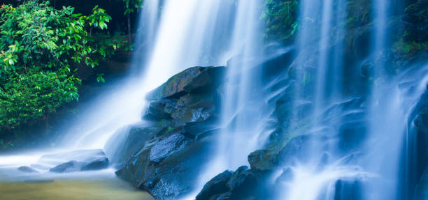 Picturesque tropical waterfall on summer morning.