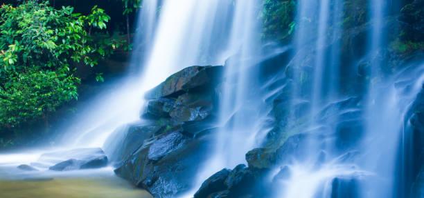 Photo of Picturesque tropical waterfall on summer morning.