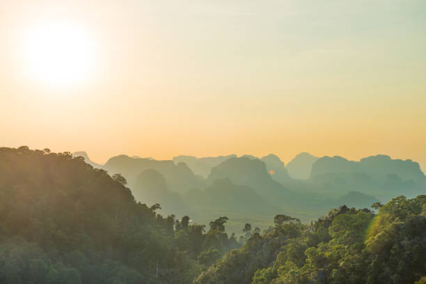 istock Tropical landscape with steep mountains at sunset 1157613009