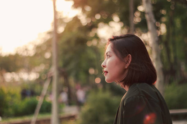 istock woman is sitting looking at 1157615419