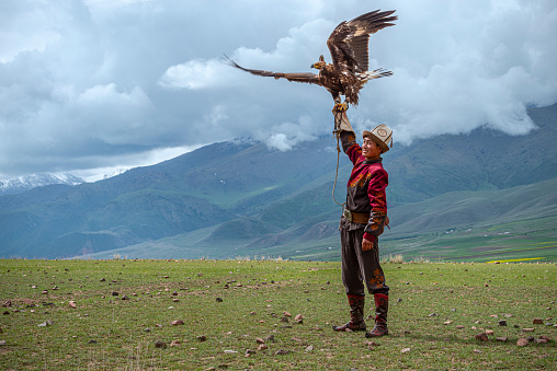 Traditional Kyrgyz Hunter Holding Eagle