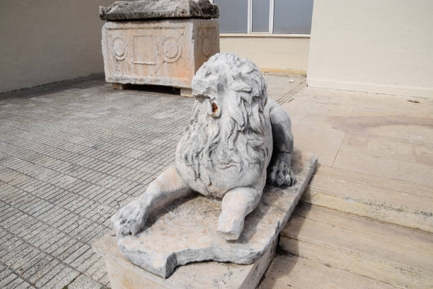 Antalya, Turkey - May 20, 2019: Ancient Marble statue of a lion at the entrance to the museum of Antalya.