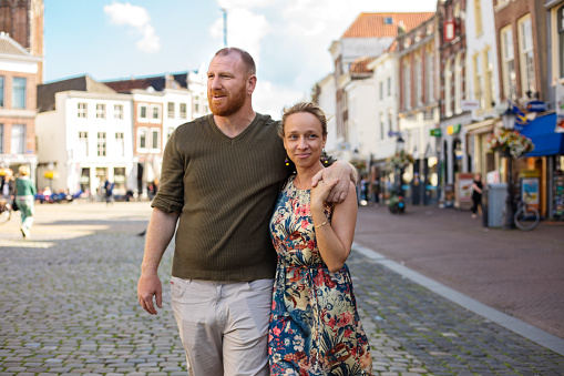 Beautiful Blonde Woman and handsome redhead man middle Aged Tourists in Gouda