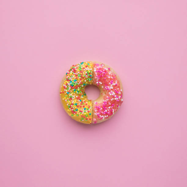 istock Delicious glazed donut on pink background. 1157621732