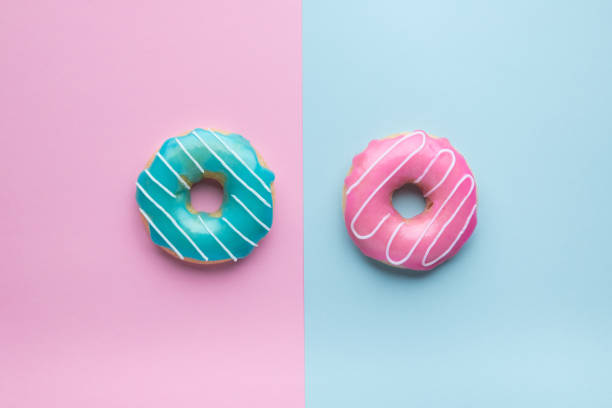 istock Blue and pink donuts on pink and blue background. 1157621963