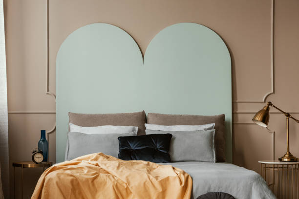 istock Pastel blue headboard of king size bed with cozy bedding and pillows 1157622607