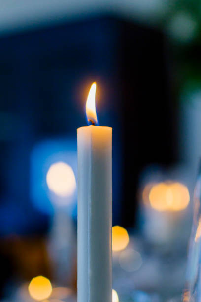 istock yellow light white candles and candles 1157625600