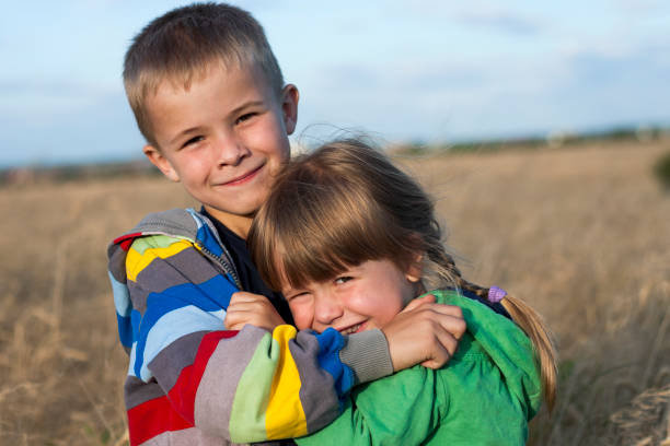 istock Two children brother and sister hugging 1157628773