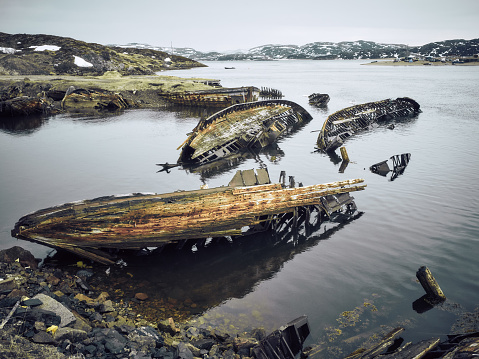 Old ruined wooden ship, shore of the Barents Sea, Teriberka, Kola Peninsula, Russia