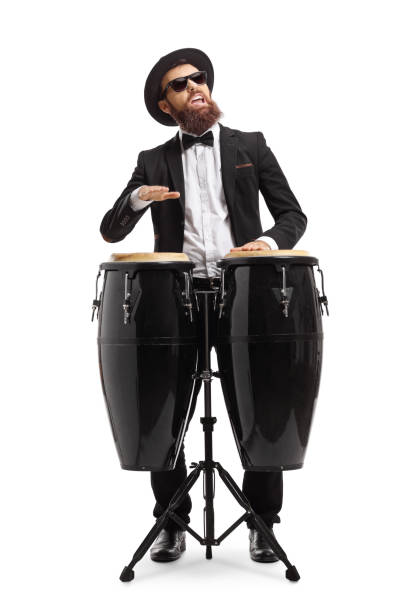istock Bearded man in a suit playing conga drums 1157628862