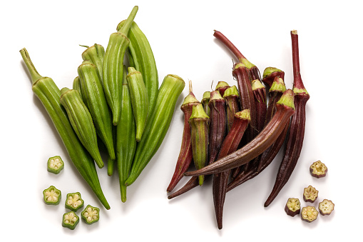 Fresh organic green and red okra isolated on a white background.