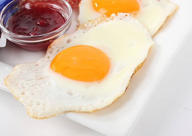 fried egg on a plate stock photo
