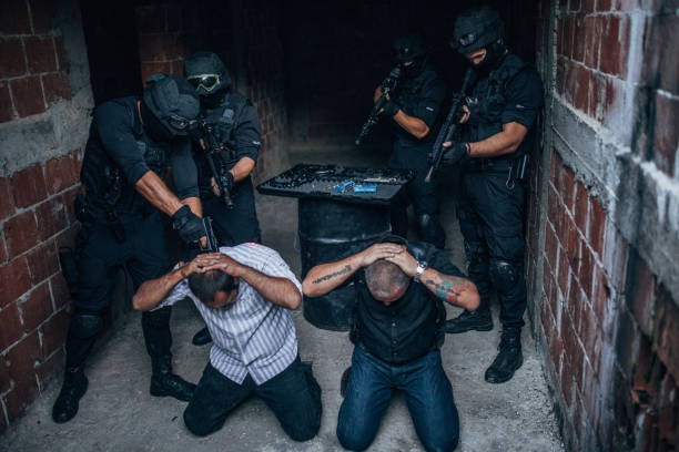 istock Police Arresting Gangster In Warehouse 1157631623