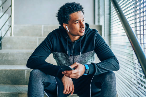 istock Male athlete with smart phone 1157633045