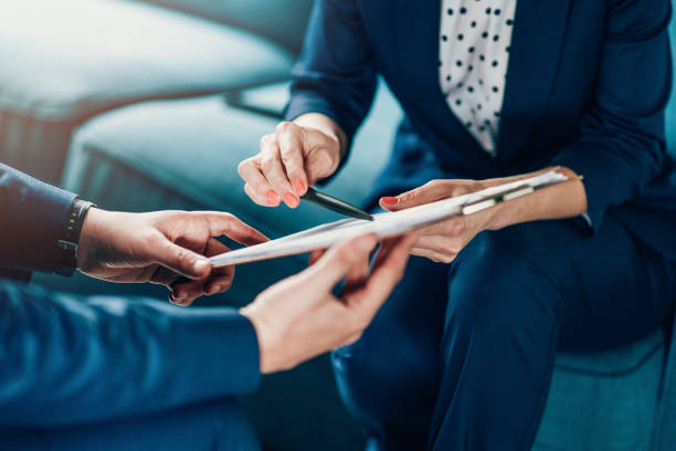 Business partners in discussion Close up of a business persons analyzing important documents business consultation stock pictures, royalty-free photos & images