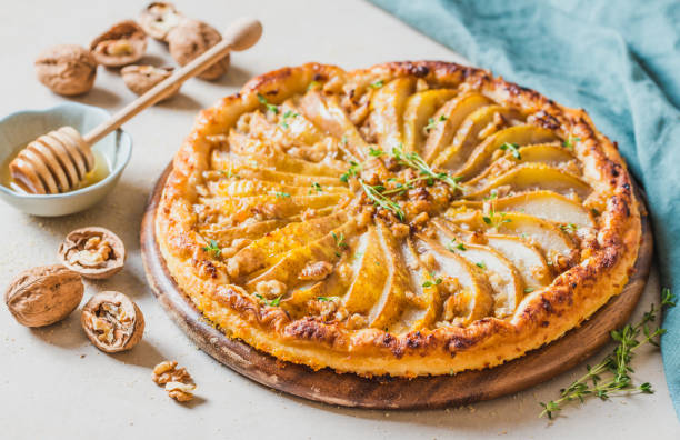istock Pear tart with nuts and honey homemade pie. 1157636196