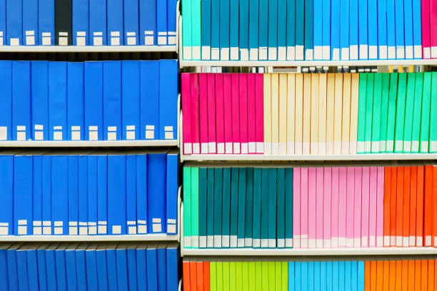 colorful stack of research books in a university library, with blank book spines. useful as a background. - library book shelf generic imagens e fotografias de stock