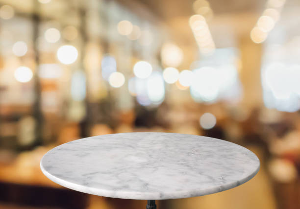 istock round marble table top with cafe restaurant bokeh lights abstract background for montage product display 1157662470