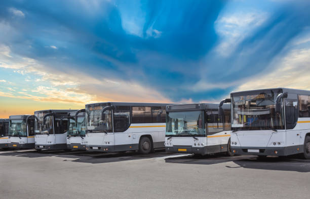 istock Buses on Parking on the background of cloudy sky 1157663858