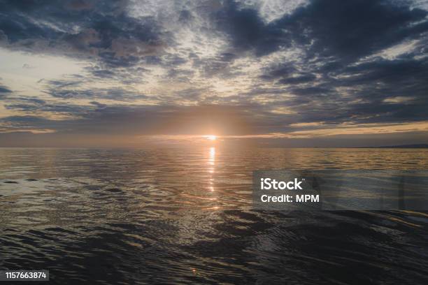 Dazzling Morning Sun Floating In The Deep Sea Stock Photo - Download Image Now - Backgrounds, Beach, Beauty