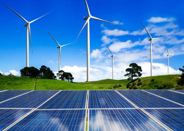 istock Solar panel and wind turbine farm clean energy. 1157670412