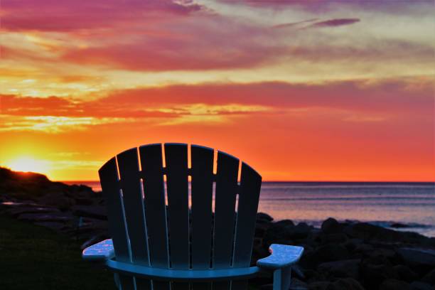 istock Adirondack chair sunrise 1157672202