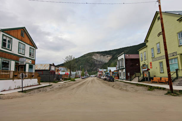 Dawson City, Canada - June 16, 2019. An overcast summer day in Dawson City, looking along the dirt streets.