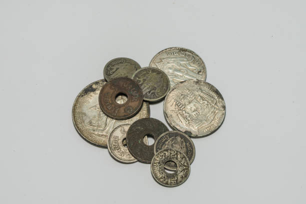 istock Ancient foreign currency and Thai currency as coins 1157676987