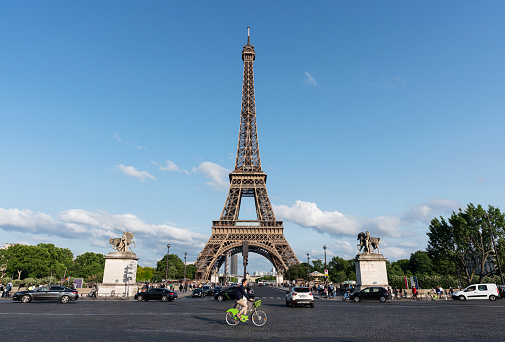 Eiffel Tower with a moody sky at dusk, shot from the Seine River, Paris, France