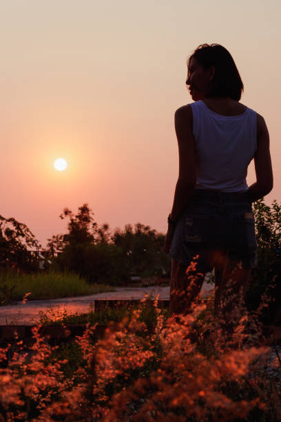 istock Women are watching the sunset. 1157687547