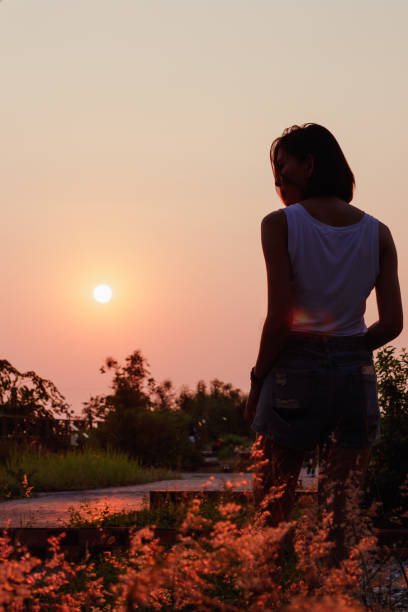 istock Women are watching the sunset. 1157687577