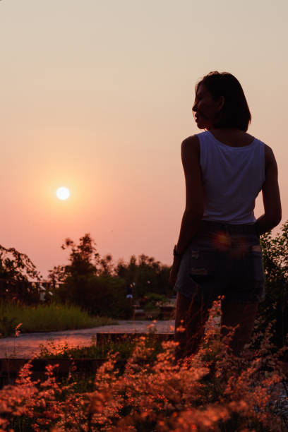 istock Women are watching the sunset. 1157687585