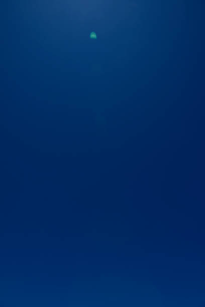 istock Dark clear sky background with lens flare. 1157700511