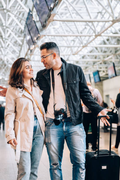 istock Couple walking at the airport 1157700786