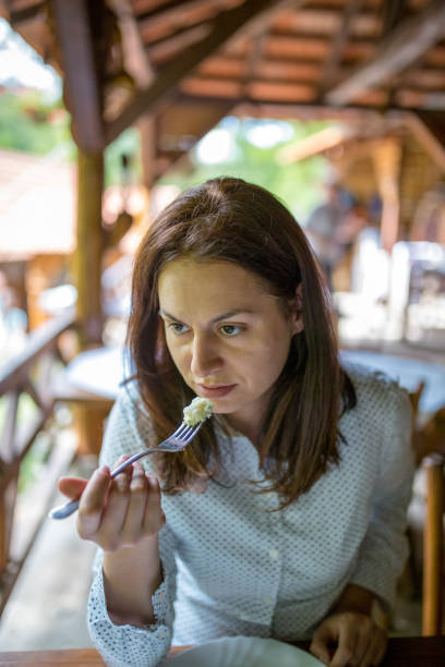 istock Woman eating 1157705838