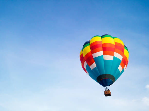 istock Hot air balloon in Flight with blue sky background 1157706039